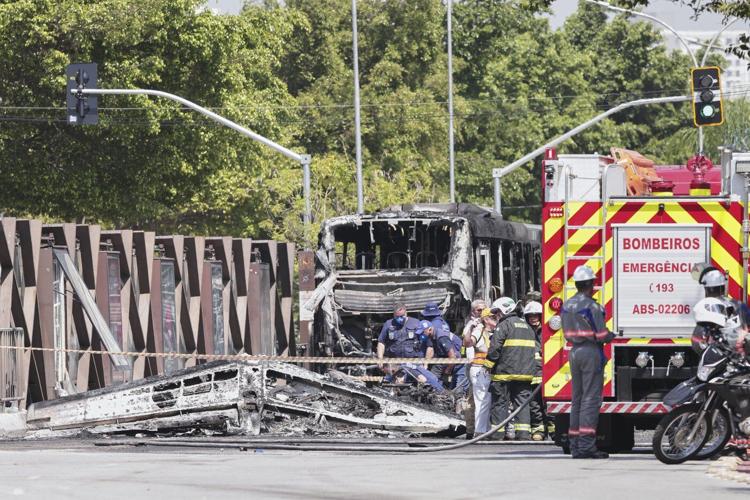A small plane loses altitude after takeoff and slams into a Sao Paulo avenue, killing 2 passengers