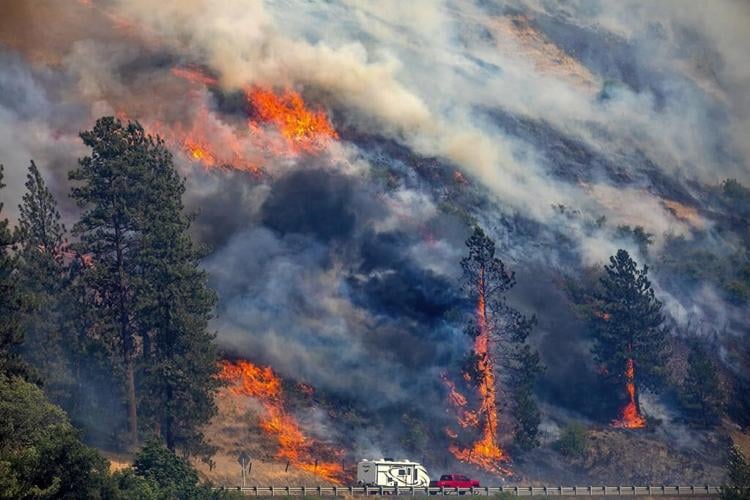 Firefighters helped by cooler weather battle blaze that has scorched area size of Los Angeles