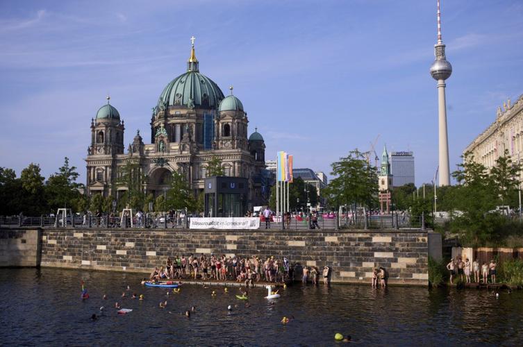 Berliners jump into the Spree River to show it's clean enough for swimming