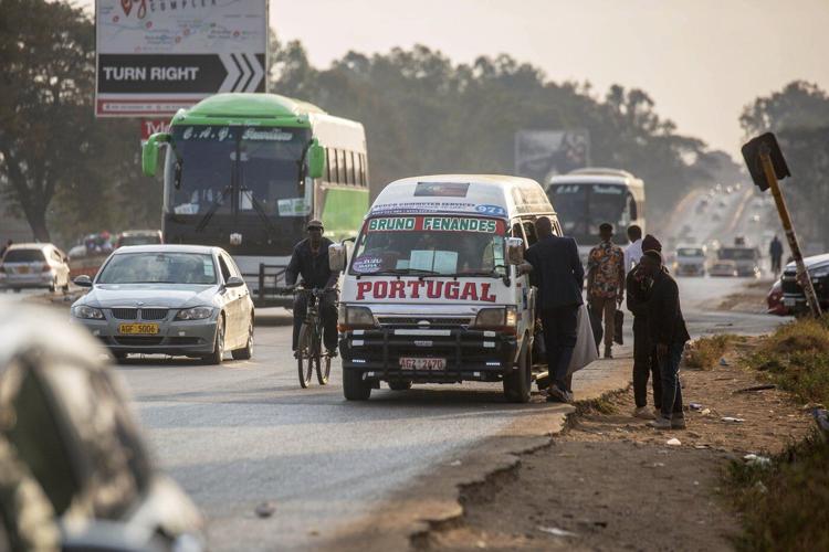 Photos of taxi drivers in Zimbabwe showing off team colors for the Premier League soccer season
