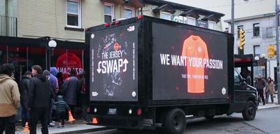 In Toronto’s Little Italy, fans line up to swap jerseys and embrace Team Canada