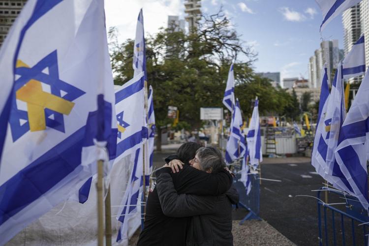 Middle East latest: Israel receives remains said to include a mother and her 2 young children