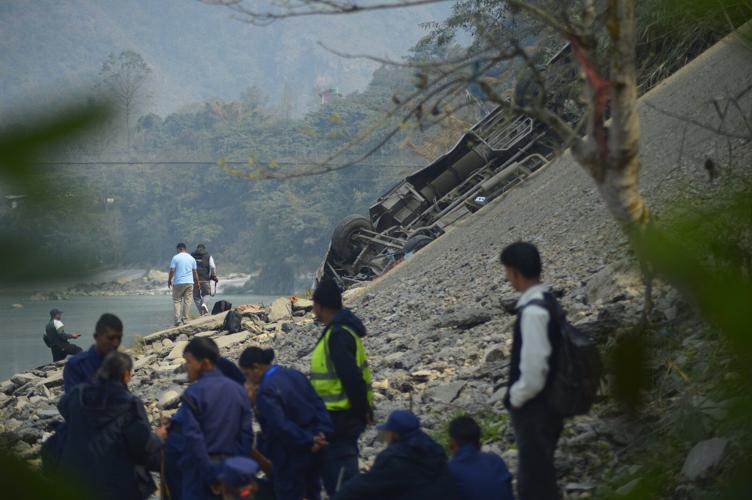 A packed bus plunges off a Nepal highway, killing 19 and injuring 25