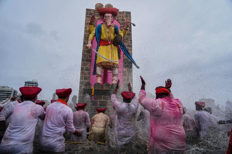 Photos show Indians marking final day of Ganesh Chaturthi that ends with sea immersion