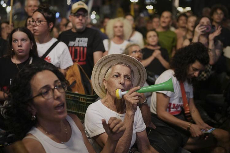 Photos of Israelis demanding the release of hostages and an end to the war with Hamas