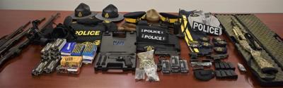 Man facing charges after Cape Breton police seize weapons, ammunition, RCMP uniform