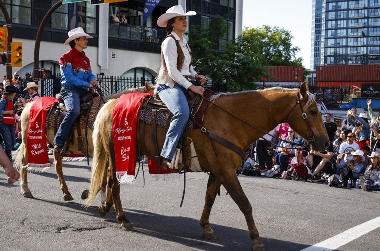 'You suuuuuck!': Smith gets cheers and jeers riding in Calgary Stampede parade