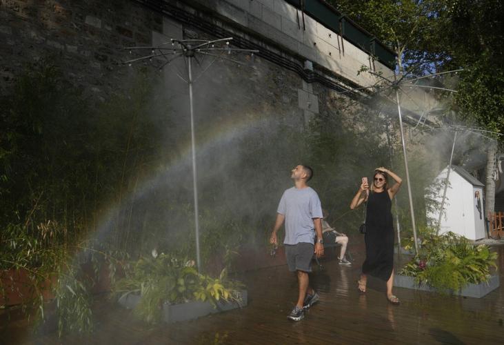 Southwest France swelters under a heat wave as fire crews guard smoldering vineyards