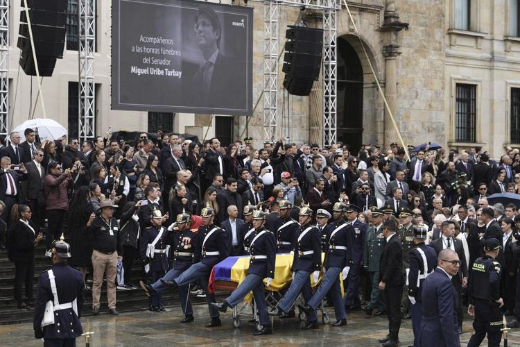 Colombians bid farewell to presidential hopeful Uribe after shooting at political rally