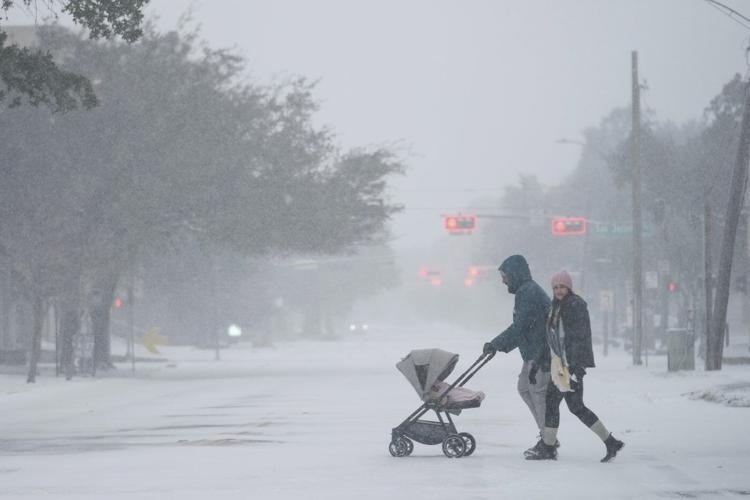 Winter storm that dropped record-breaking snow in New Orleans spreads into Florida and the Carolinas