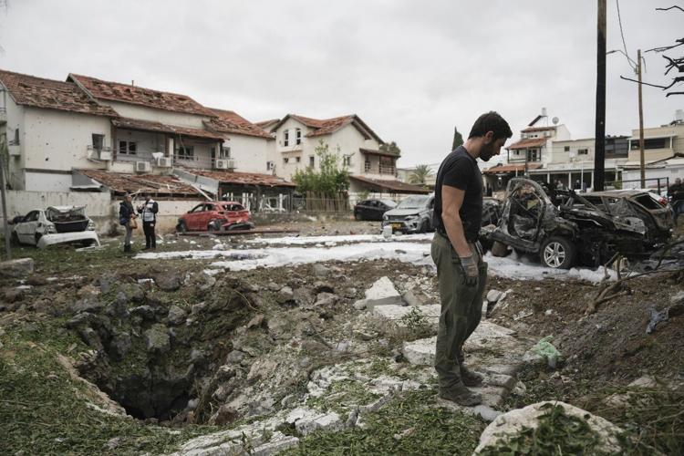 Hezbollah fires about 250 rockets and other projectiles into Israel, wounding at least 7