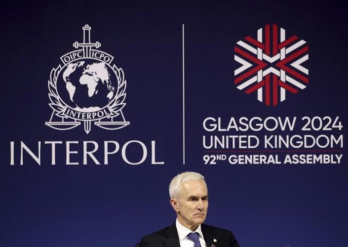 UK leader tells Interpol meeting world must 'wake up' to threat from people-smugglers