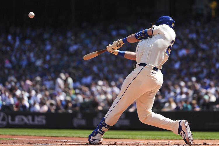 Cal Raleigh hits his 48th, 49th homers to set MLB season mark for catchers, passing Salvador Perez