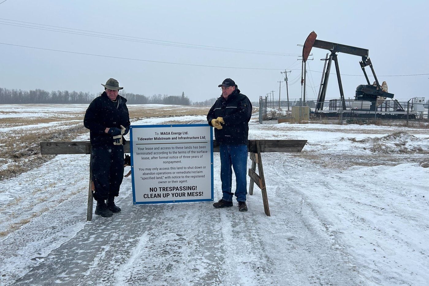 A group of Edmonton landowners are taking a stand against an Alberta energy company that hasn't been making its lease payments for three years. Dale Braun, left, and Mark Dorin, right say their lease agreement with MAGA Energy dictates that if the company doesn't make the payments, the landowners are allowed to terminate the agreement and block the company from accessing a couple of oil wells on a piece of farmland in southwest Edmonton, pictured on Thursday, March 12, 2026. THE CANADIAN PRESS/Jack Farrell
