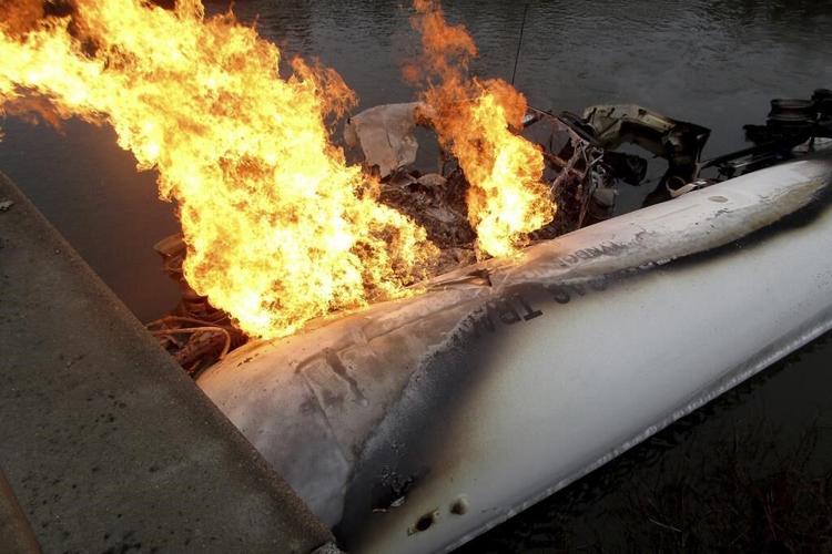 Heavy snowfall drops tree branches onto power lines, causing outages in New England