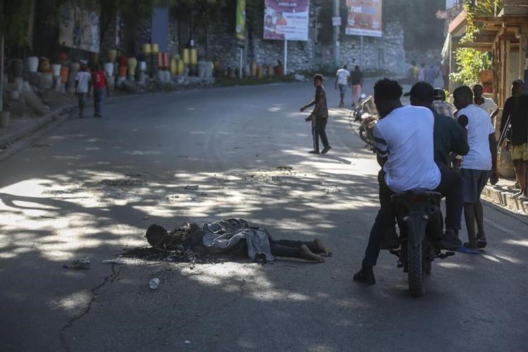 Residents in Haiti's capital stand with police in a battle to repel the latest gang attack