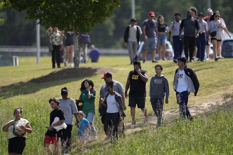 Shooter kills 4 at a Georgia high school and a 14-year-old student is in custody, officials say