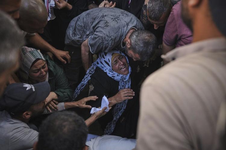 Israeli airstrikes kill 14 Palestinians in Gaza and another 10 die seeking food