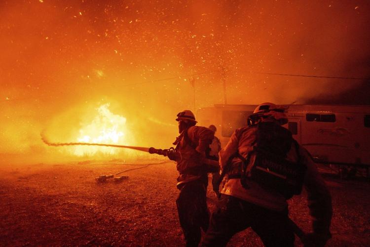 Firefighters battle to maintain the upper hand on a huge fire north of Los Angeles