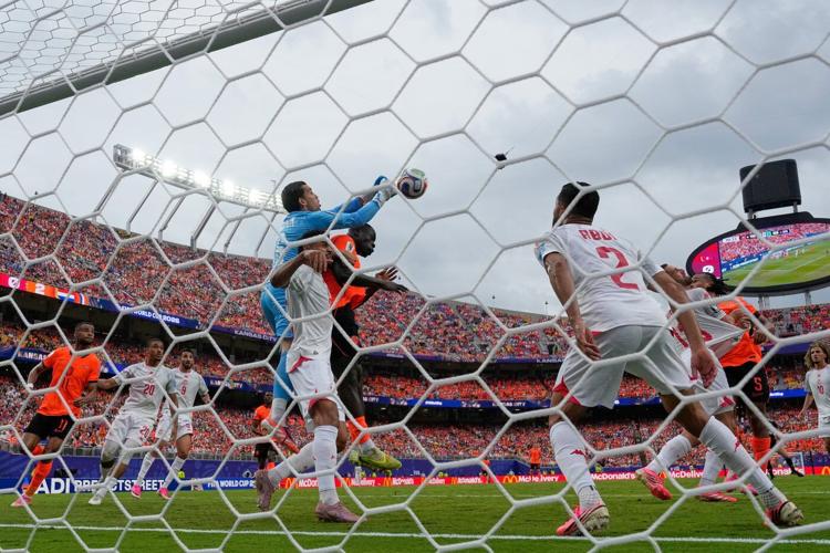 Brian Brobbey and the Dutch roll in the rain to a 3-1 win over Tunisia to top World Cup Group F