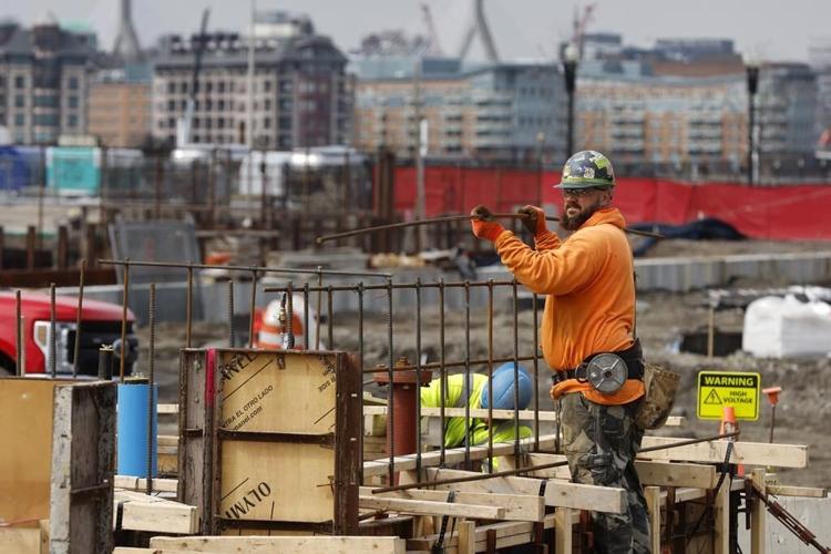 US revises down last quarter's economic growth to 2.6% rate
