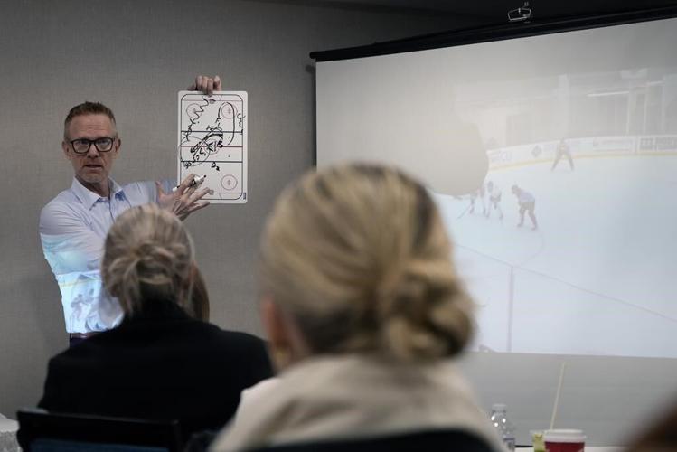 The AP goes behind the scenes at PWHL opener to capture 'the birth of women's hockey'