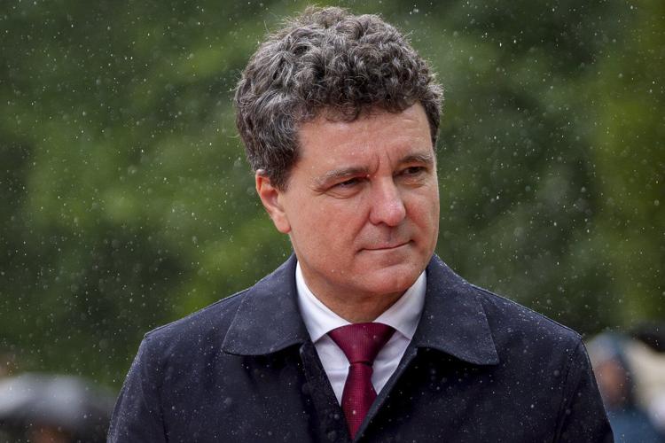 Romania's new president is sworn in as a political crisis eases, but challenges loom