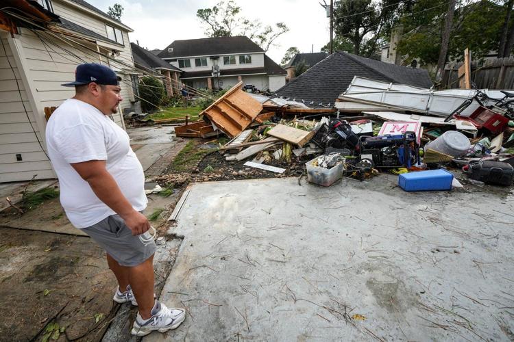 Torn roofs and smashed windows among damage to over 100 homes in a tornado near Houston
