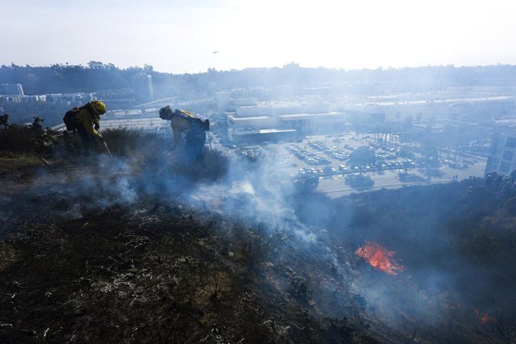 Fire risk and strong winds continue in Southern California with potential rain on the horizon