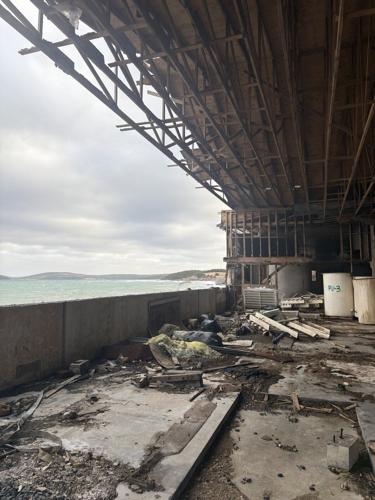 Rancid Newfoundland fish sauce plant is being cleaned up. Whose responsibility is it?