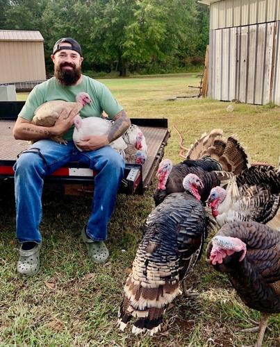 An Arkansas man accused of killing his daughter's alleged abuser wins GOP sheriff's nomination