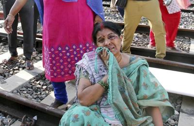 A fire inside a parked train kills 9 in southern India