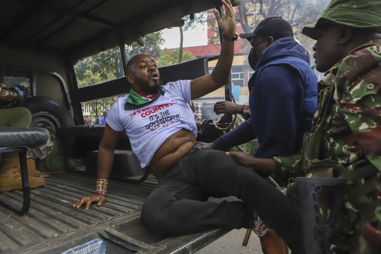Kenyan pro-democracy activist Boniface Mwangi is charged with alleged possession of ammunition