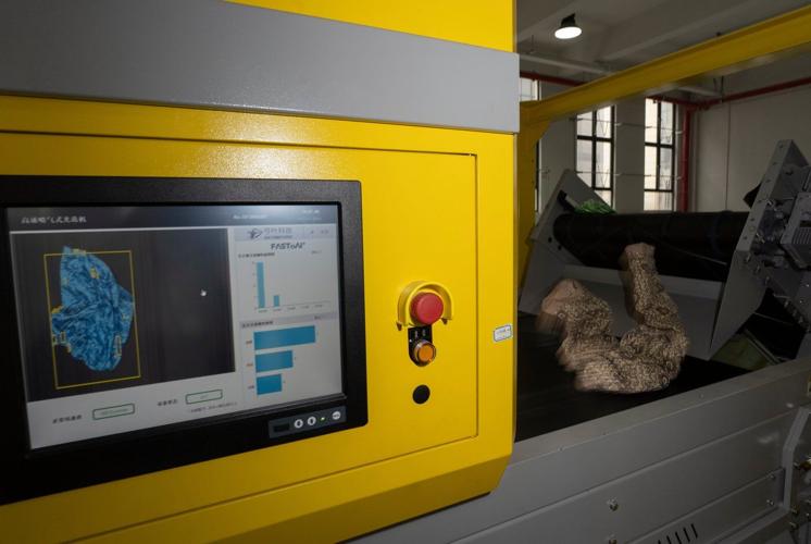 AI machine sorts clothes faster than humans to boost textile recycling in China