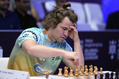 Chess grandmaster Magnus Carlsen faces showdown against 'the world.' Will it end in a draw?