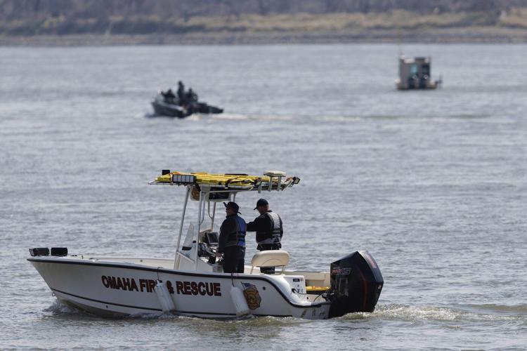 Nebraska officials search the Missouri River near Omaha for two teens and a child