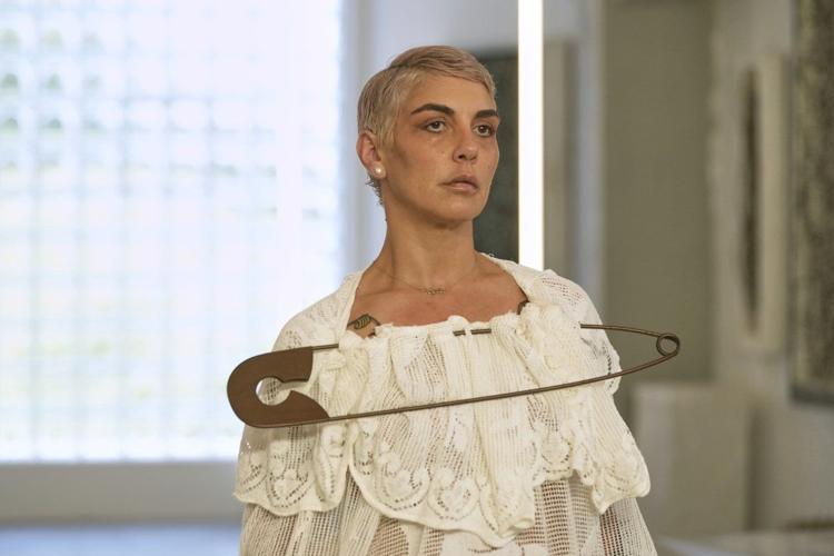 Simon Cracker creates a brand uniform to highlight star upcycled garments during Milan Fashion Week