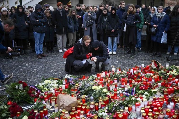 Police seek a motive as Prague mourns the 14 people killed in the nation's worst mass shooting