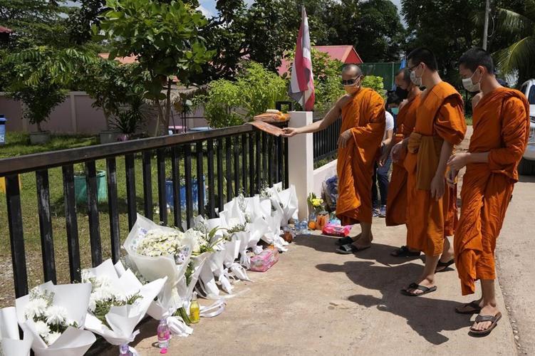 Mourners pray at Thai temple filled by children's keepsakes