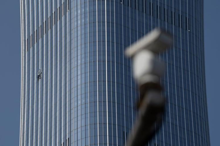 Small plane crash at Beijing high-rise kills the pilot and injures 13, authorities say