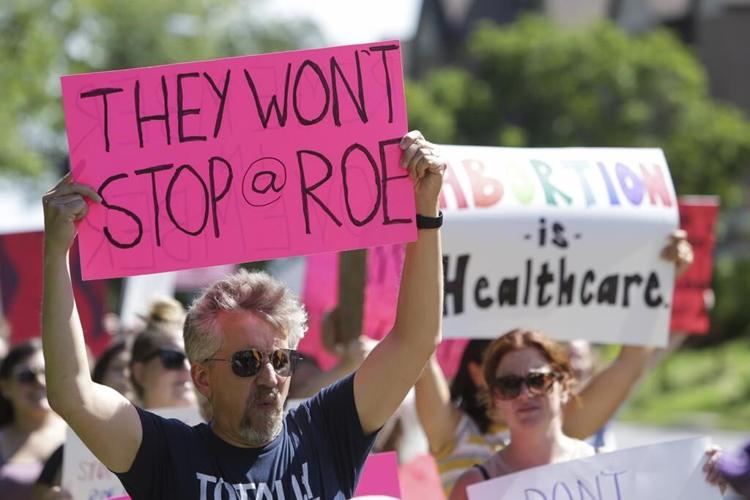 Iowa's Republican governor calls a special legislative session to revive abortion restrictions