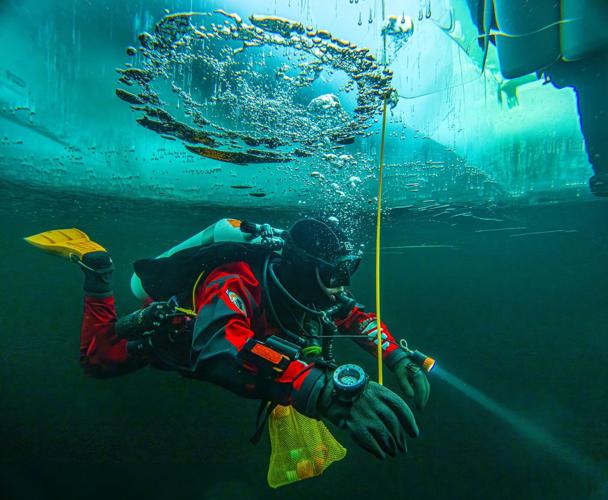 Scientists train to dive beneath polar ice as climate change warms the Arctic and Antarctica