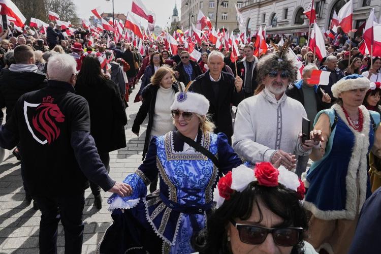 Poles celebrate coronation of 1st king at march supporting conservative presidential candidate