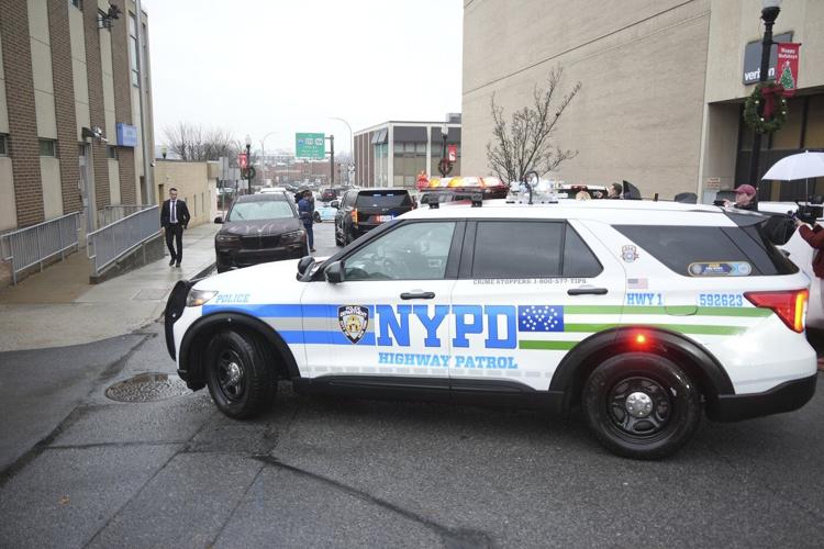 The Latest: UnitedHealthcare shooting suspect is charged with murder in New York City