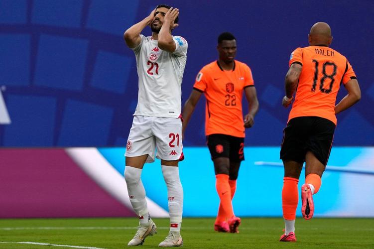 Brian Brobbey and the Dutch roll in the rain to a 3-1 win over Tunisia to top World Cup Group F