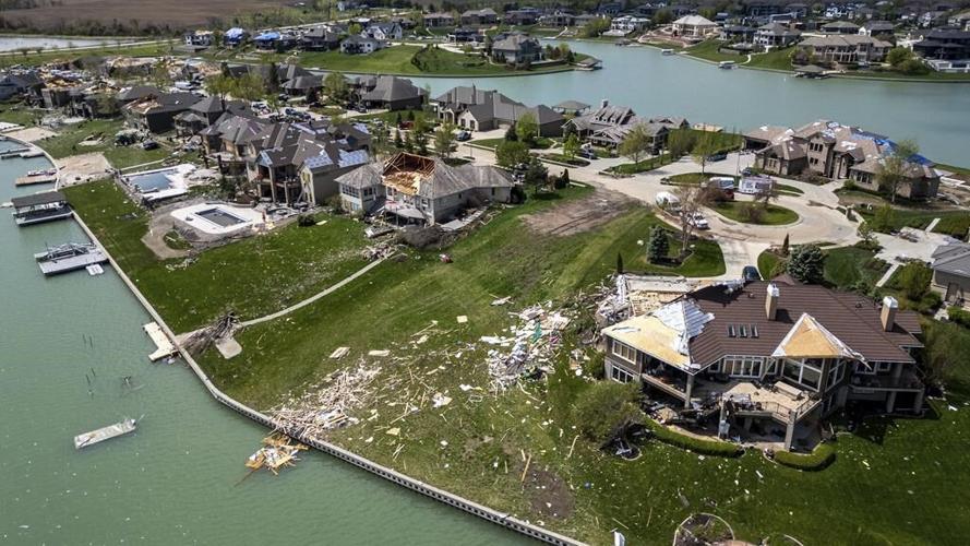 Residents begin going through the rubble after tornadoes hammer parts of Nebraska and Iowa
