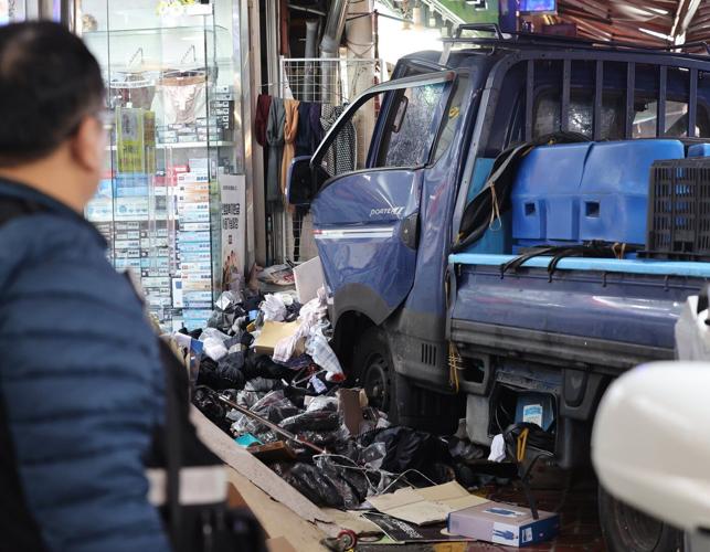 Truck crash in South Korea market kills 2 people and injures 18, officials say