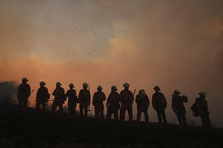 Firefighters make progress against blaze that forced thousands to flee north of Los Angeles