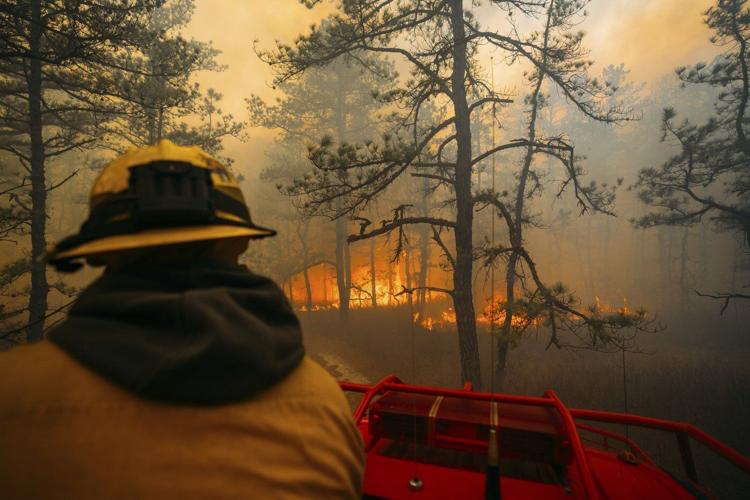 Firefighters in the Carolinas battle multiple wildfires as New Jersey crews contain a forest blaze