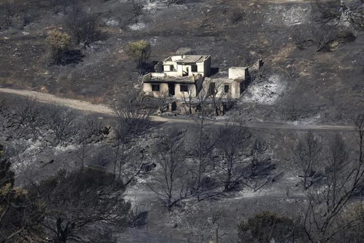 Two wildfires are burning near Greece's capital, fueled by strong winds